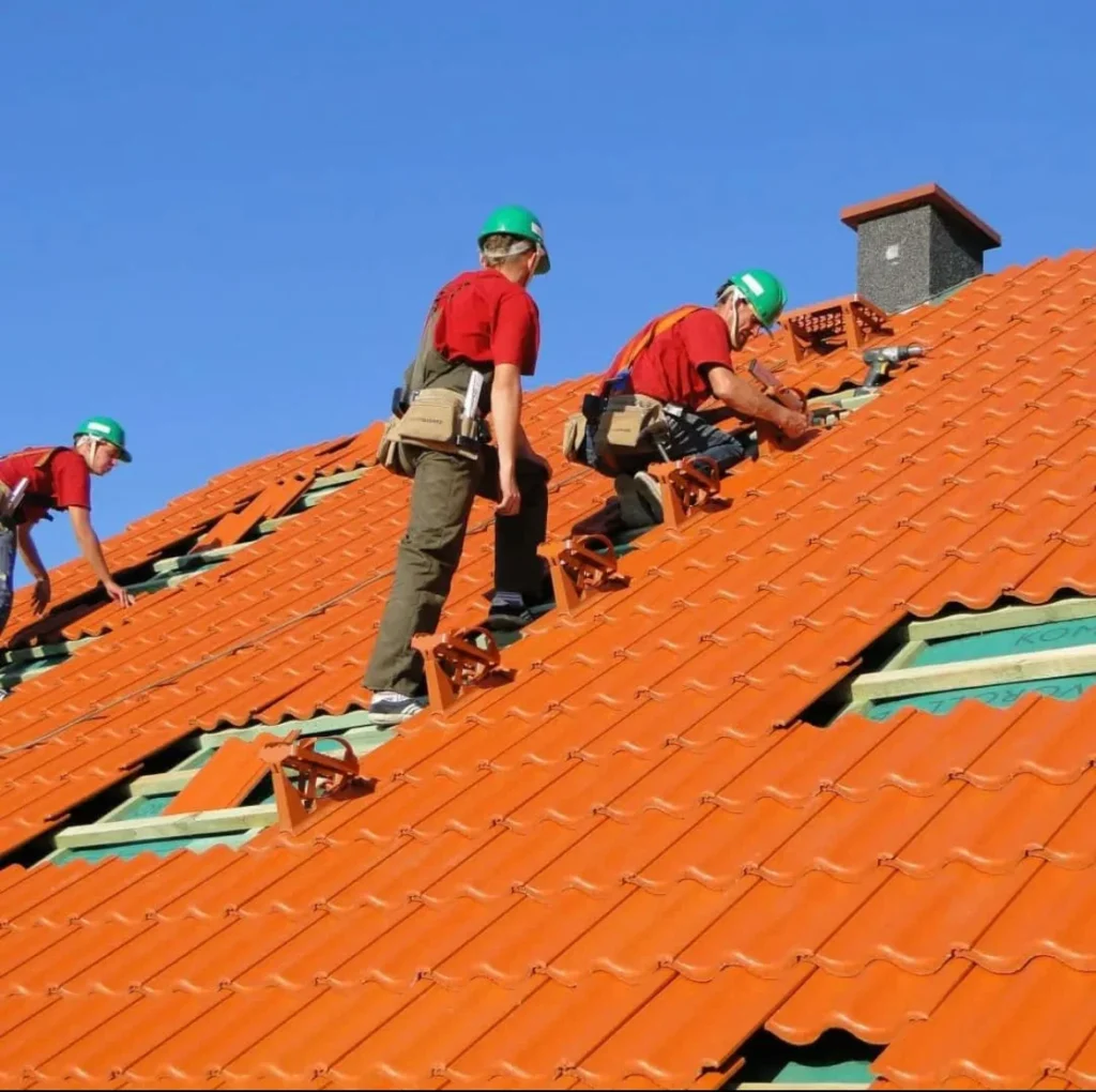 men working on roofs