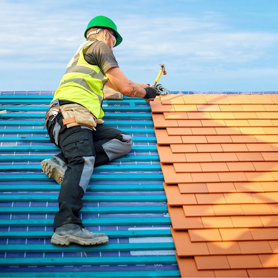 man repairing the roofs