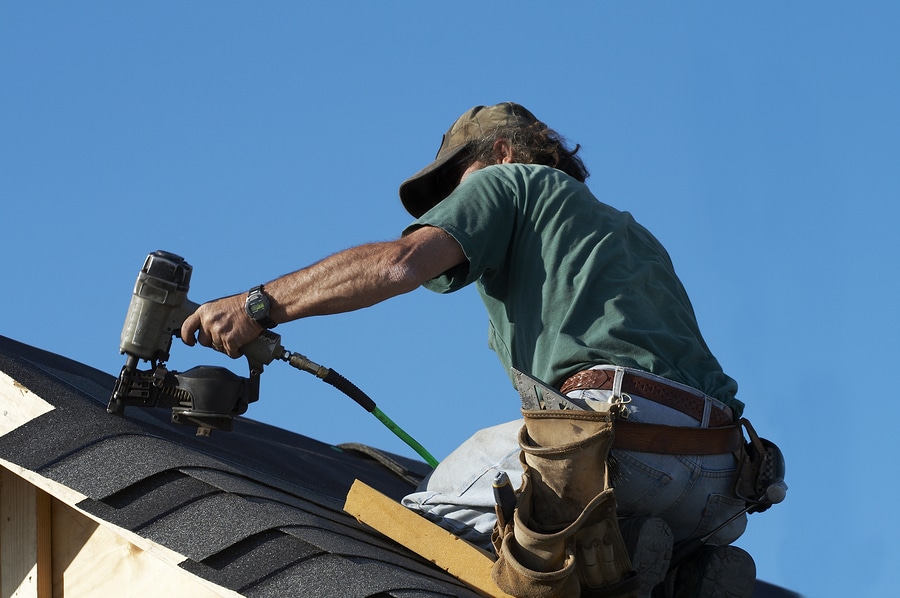 man repairing the roof