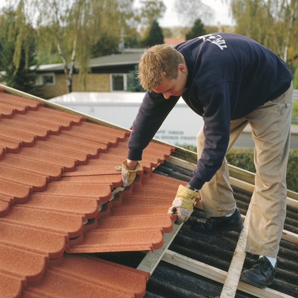 man inserting tiles