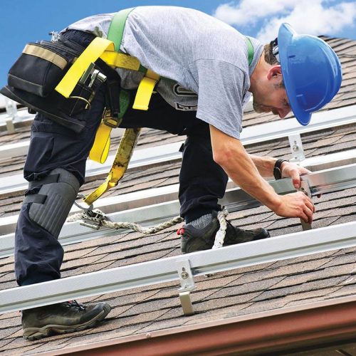 man working on roof